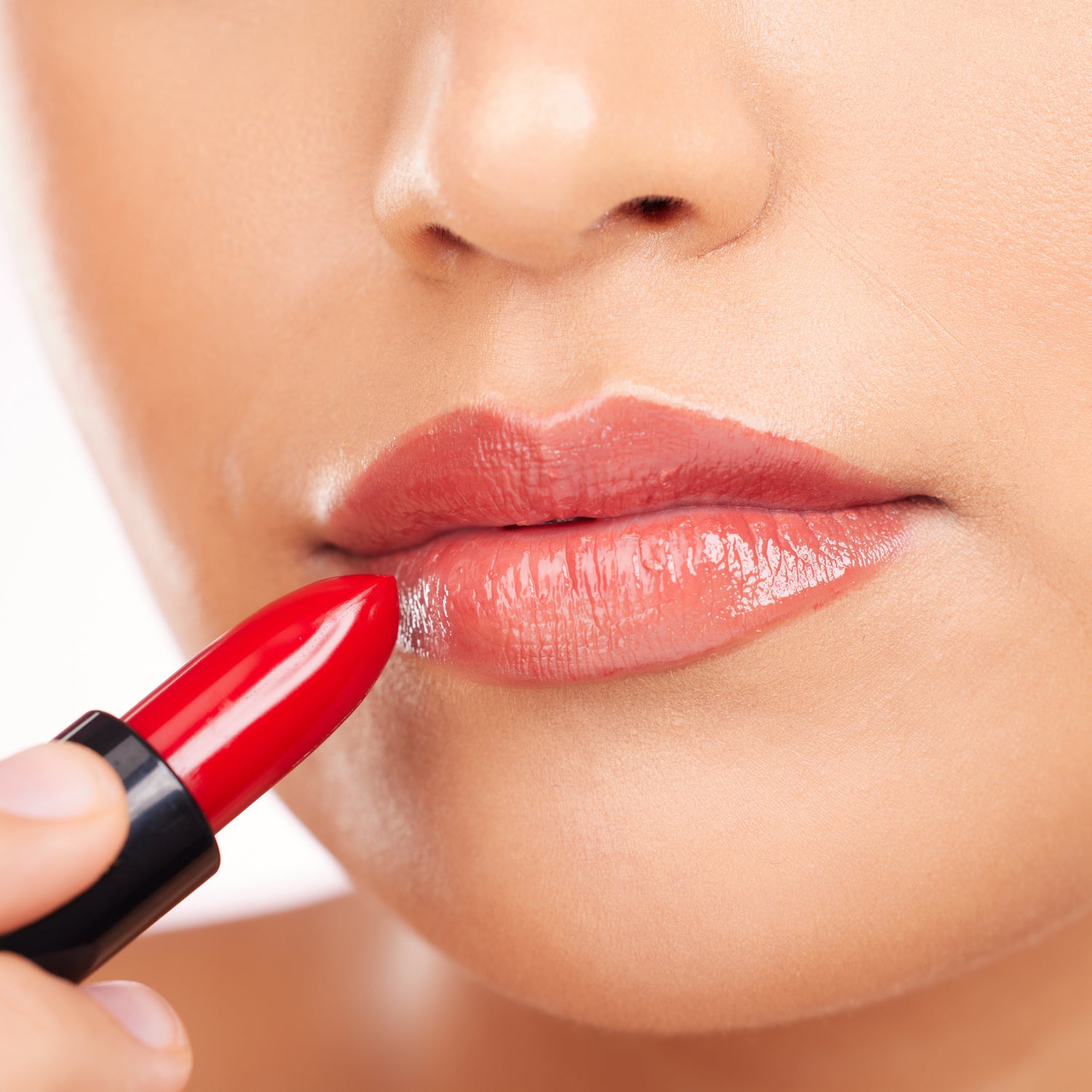adding color to her lips