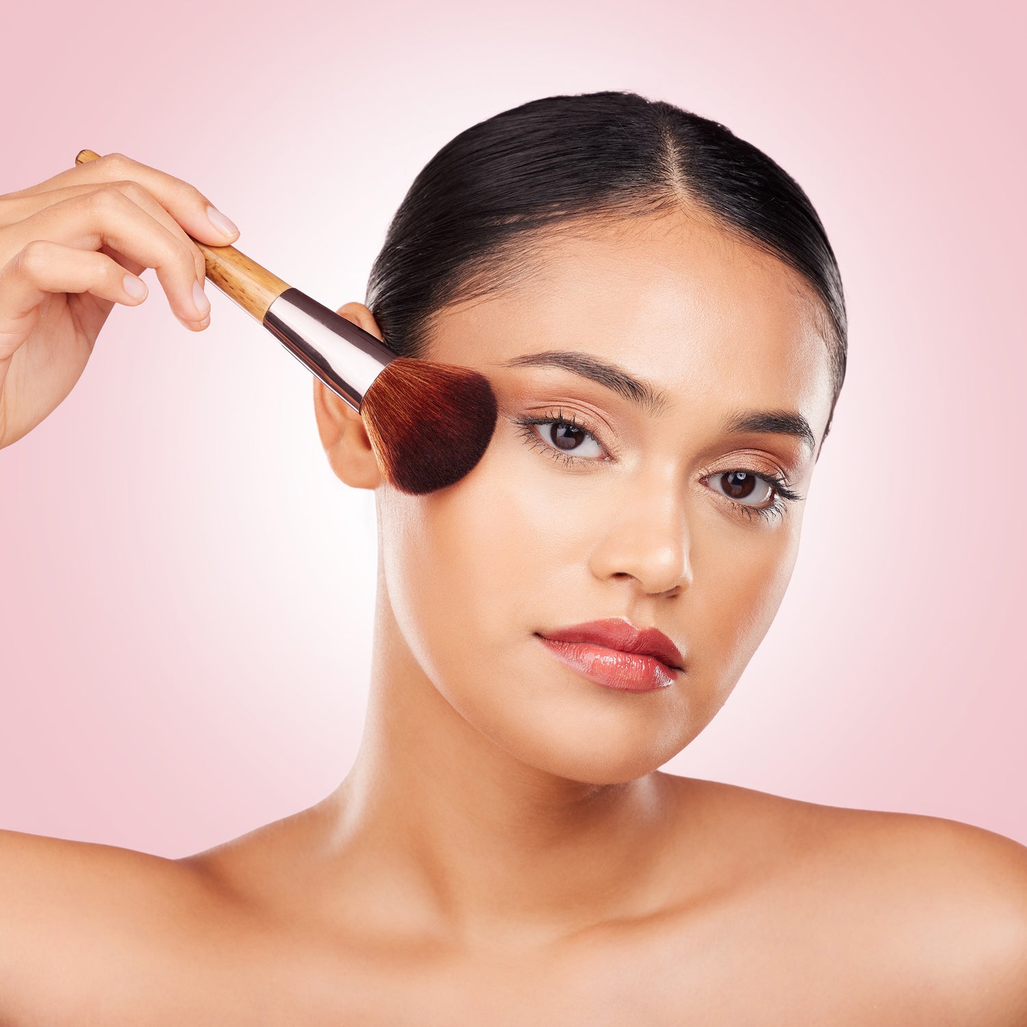 Woman applying foundation